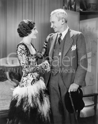 Woman greeting an older man