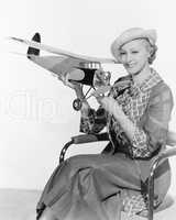 Woman holding a toy plane