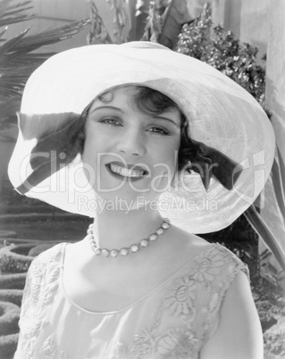 Woman in a wide brimmed hat smiling