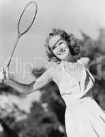 Young woman with a badminton racket