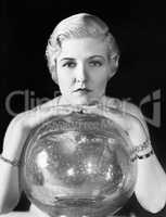 The world might be her oyster, but this young woman seems, leaning on her crystal ball