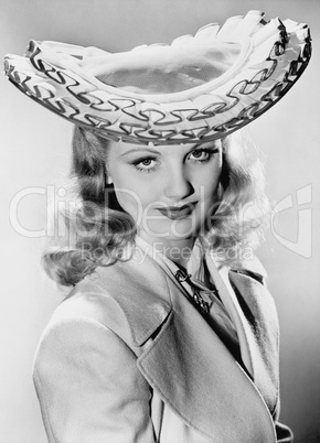 Young woman wearing her exotic hat