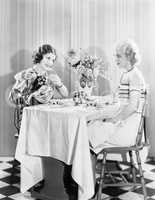 Two women having tea together