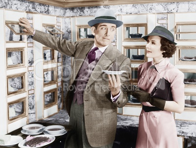 Man serving a dish to a woman in a Automat