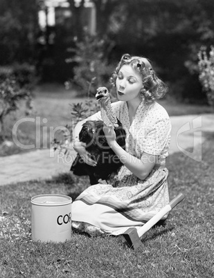 Young woman, with an ax next to her, hugs a turkey