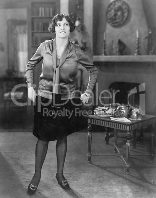 Young woman standing in a living room