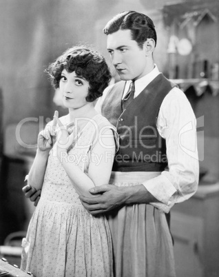 Couple standing together in the kitchen