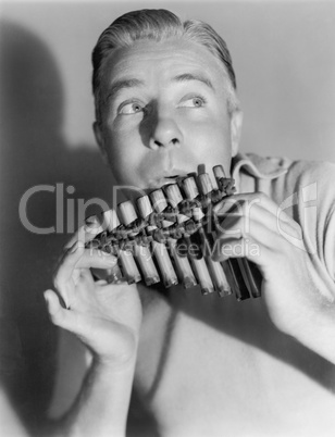 Man playing a pan flute