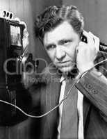 A man listening on the telephone