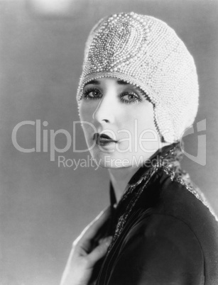 Young woman in beaded cap