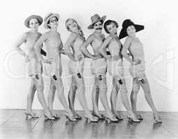 Women standing in a chorus line in lingerie