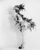 Young woman dressed like a bird is all feathered up and no place to go