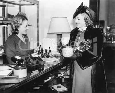 Two women in a pipe store