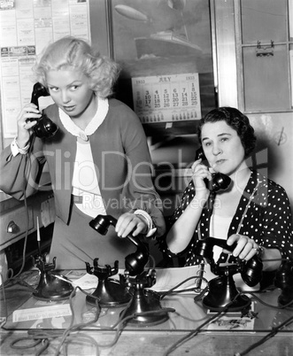Two women working on a phone bank