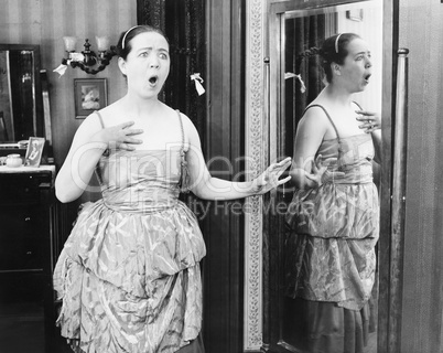 Young woman with pigtails, looking surprised