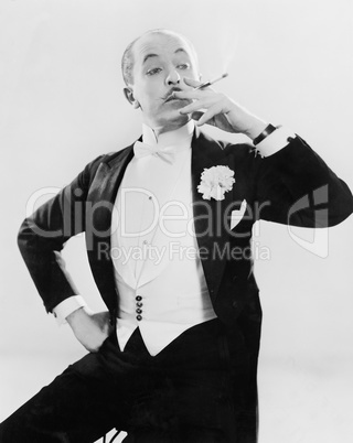 Man in white tie posing with a cigarette
