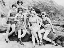Six women posing at the beach