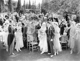 Wedding party toasting to the bride and groom