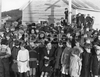Large group of children and adults outside
