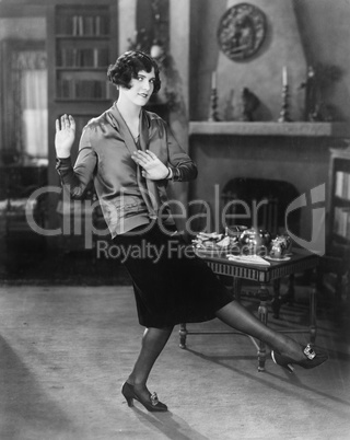 Young woman dancing in her living room