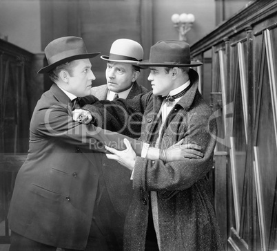 Three men arguing with each other