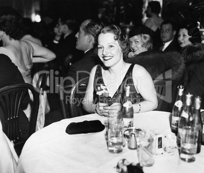 Woman sitting at a table in a club