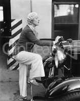 Woman putting gas in the front of her car