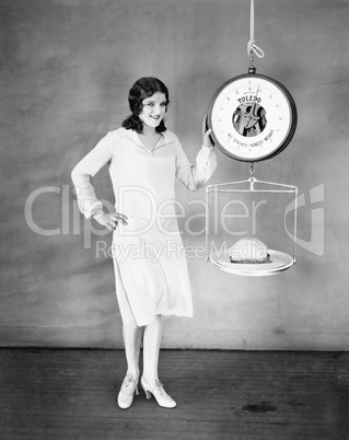 Woman weighing her hat