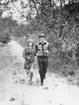 Couple jogging through the country side