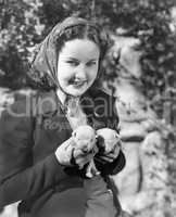 Woman holding two English Bull Terrier puppies