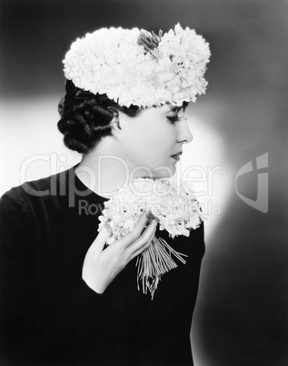 Portrait of an elegant woman holding a bouquet of flowers
