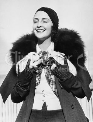 Woman holding two white bunnies in her hands