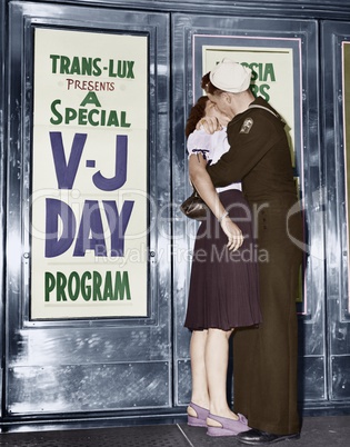 U.S. sailor and his girlfriend celebrate news of the end of war with Japan in front of the Trans-Lux Theatre in New York's Time Square (EV007196_M)