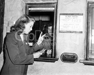 One woman buying two tickets
