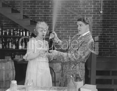 Couple looking at spraying bottle