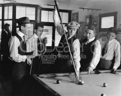 Group of men playing snooker