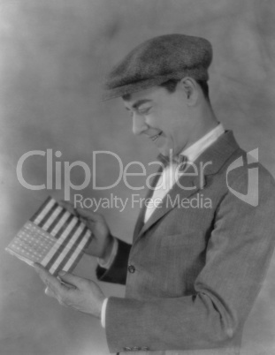 Smiling man looking at flag