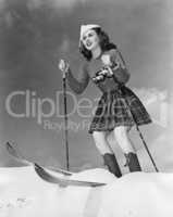 Low angle view of young woman skiing
