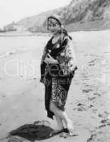 Woman in kimono on beach