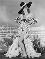 Woman posing in striped and polkadot costume