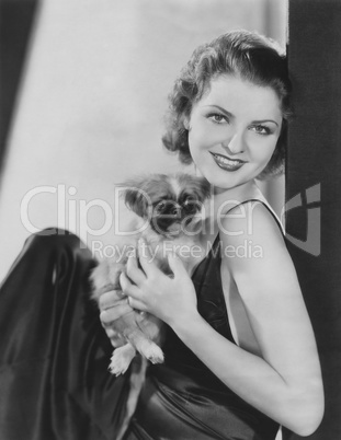 Pretty woman with her pekingese puppy