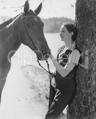 Woman petting horse