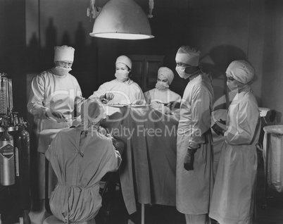 Team of surgeons perform operation