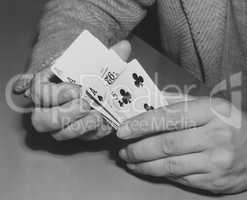 Close-up of man's hands shuffling playing cards