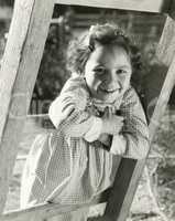 Little girl leaning on ladder