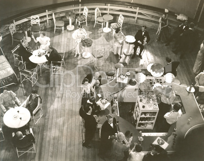 High angle view of people at cocktail lounge aboard ship