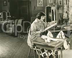 Young woman painting at home