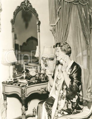 Applying perfume Applying perfume