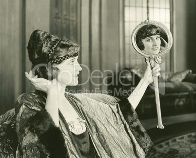 Woman admiring her hairstyle