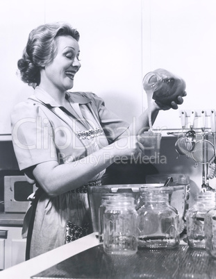 Woman measuring preserves